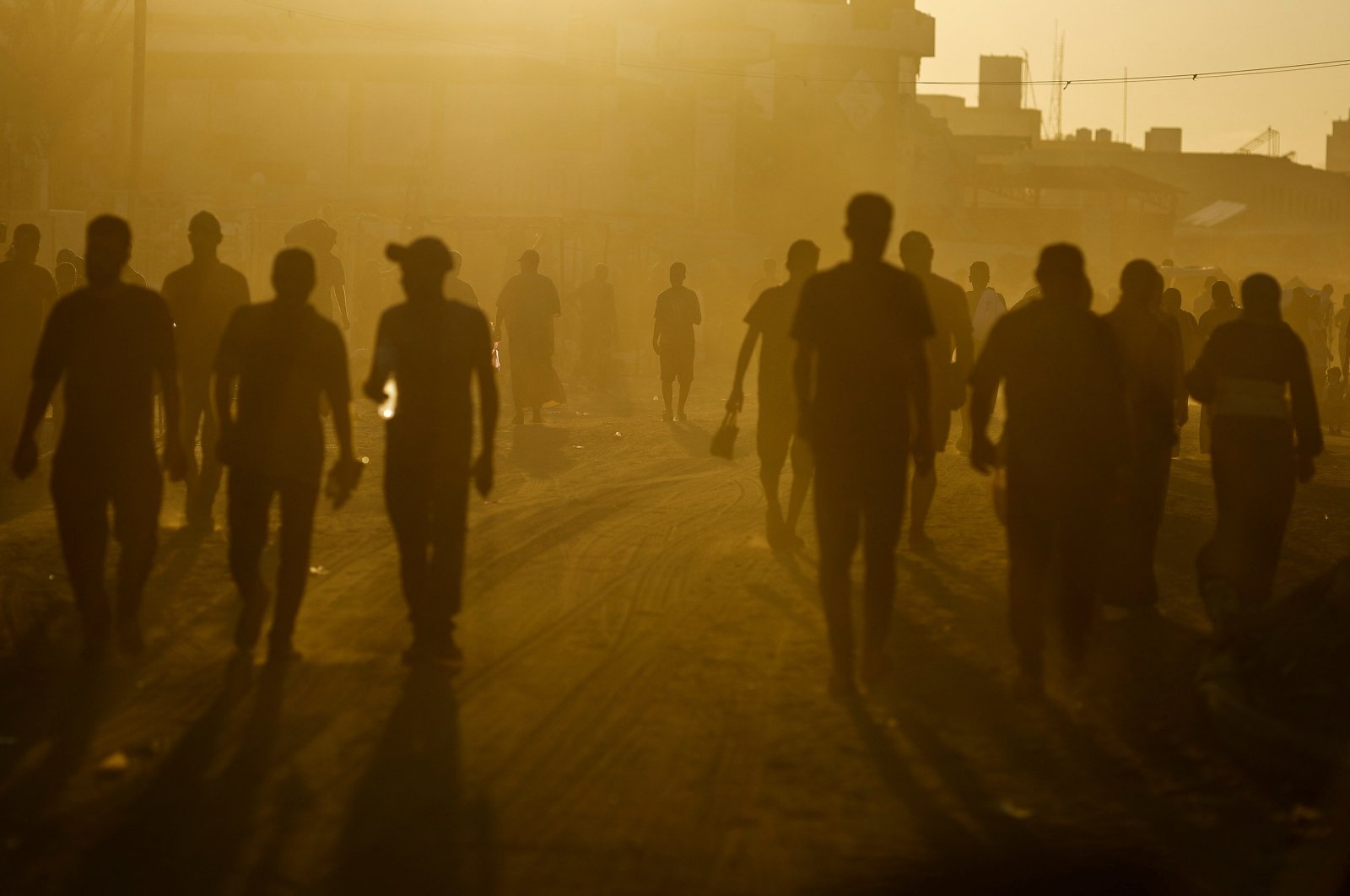 Palestinians walk in an area damaged during the Israeli offensive, in Khan Younis, southern Gaza Strip, Palestine, Aug. 20, 2024. (Reuters Photo)