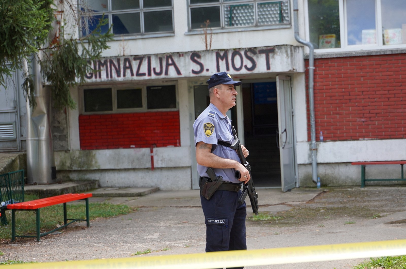 A police officer stands guard outside the scene of the shooting, Sanski Most, Bosnia-Herzegovina, Aug. 21, 2024. (Reuters Photo)