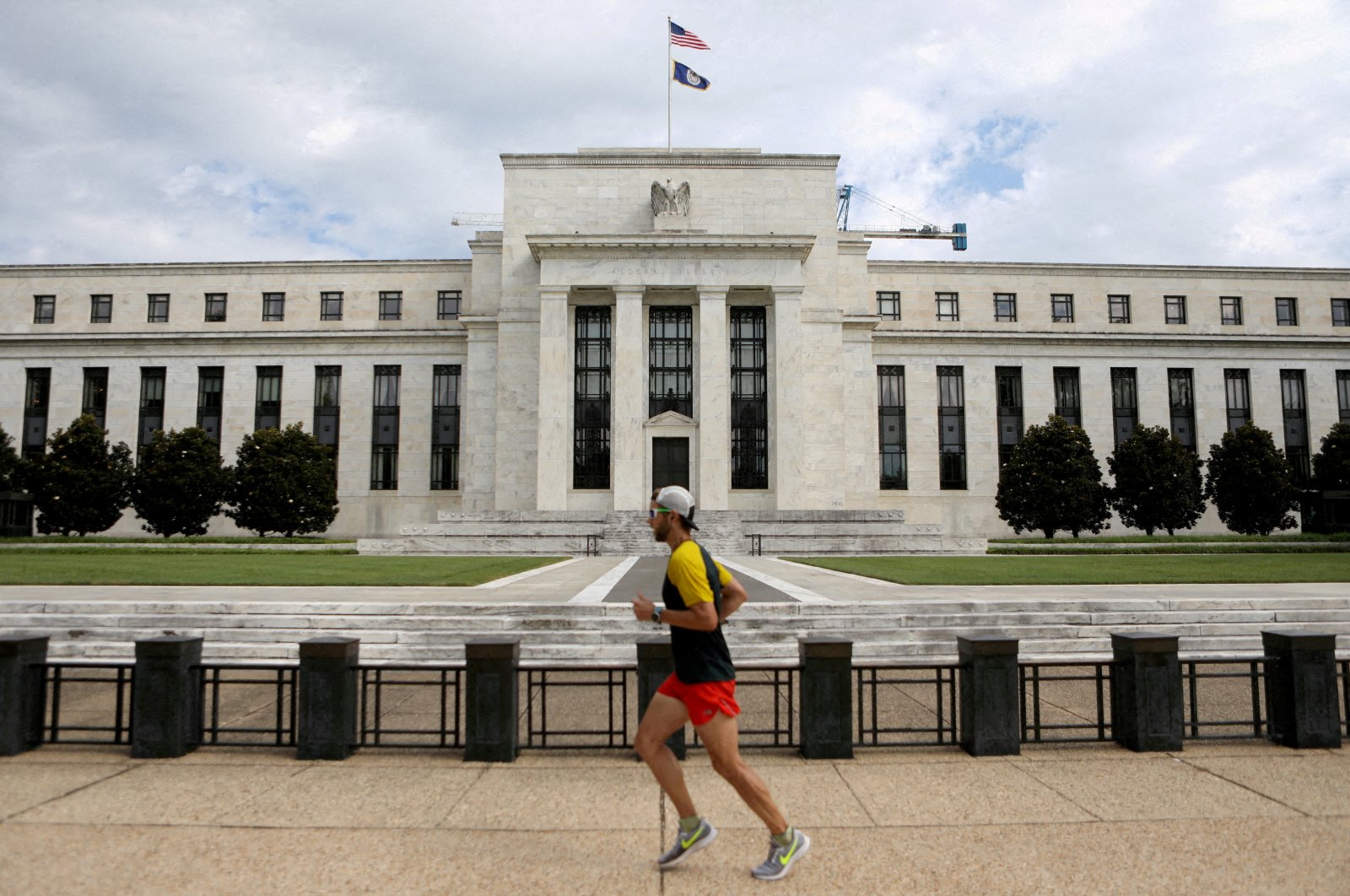 A jogger runs past the Federal Reserve building in Washington, D.C., U.S., Aug. 22, 2018. (Reuters File Photo)