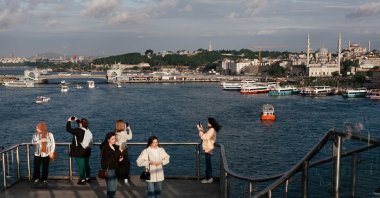 People take scenic photos near the Golden Horn, Istanbul, Turkiye, May 11, 2024. (Reuters Photo)