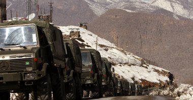 A convoy of Turkish military trucks carrying troops arrives in Çukurca at the Turkish-Iraqi border, in Hakkari, southeastern Türkiye, Feb. 28, 2008. (AP Photo)