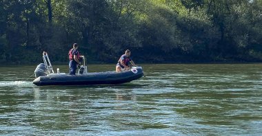 Rescue Service members search the Drina River near the town of Bratunac, Bosnia, Aug. 22, 2024. (AP Photo)