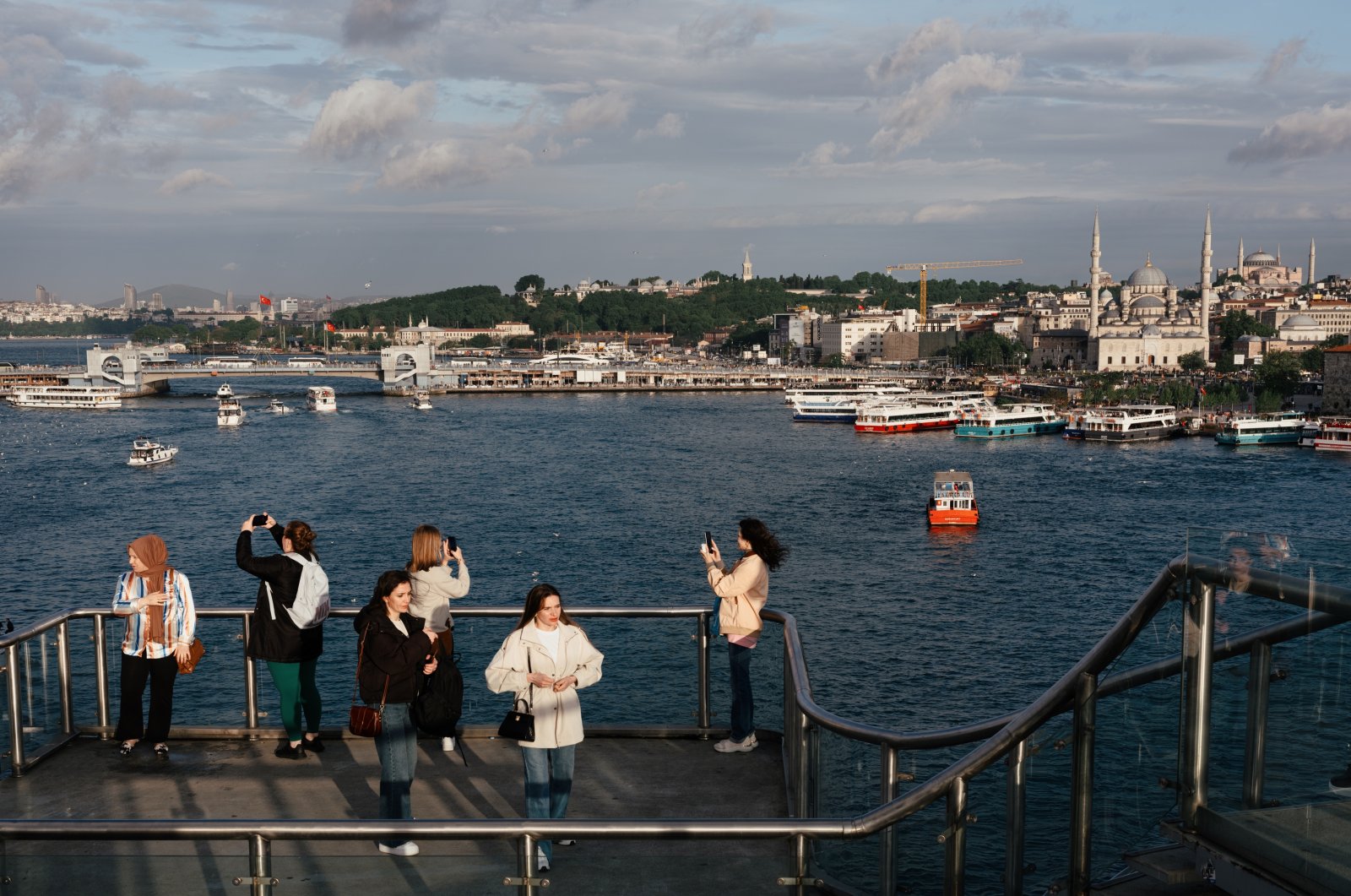 People take scenic photos near the Golden Horn, Istanbul, Turkiye, May 11, 2024. (Reuters Photo)