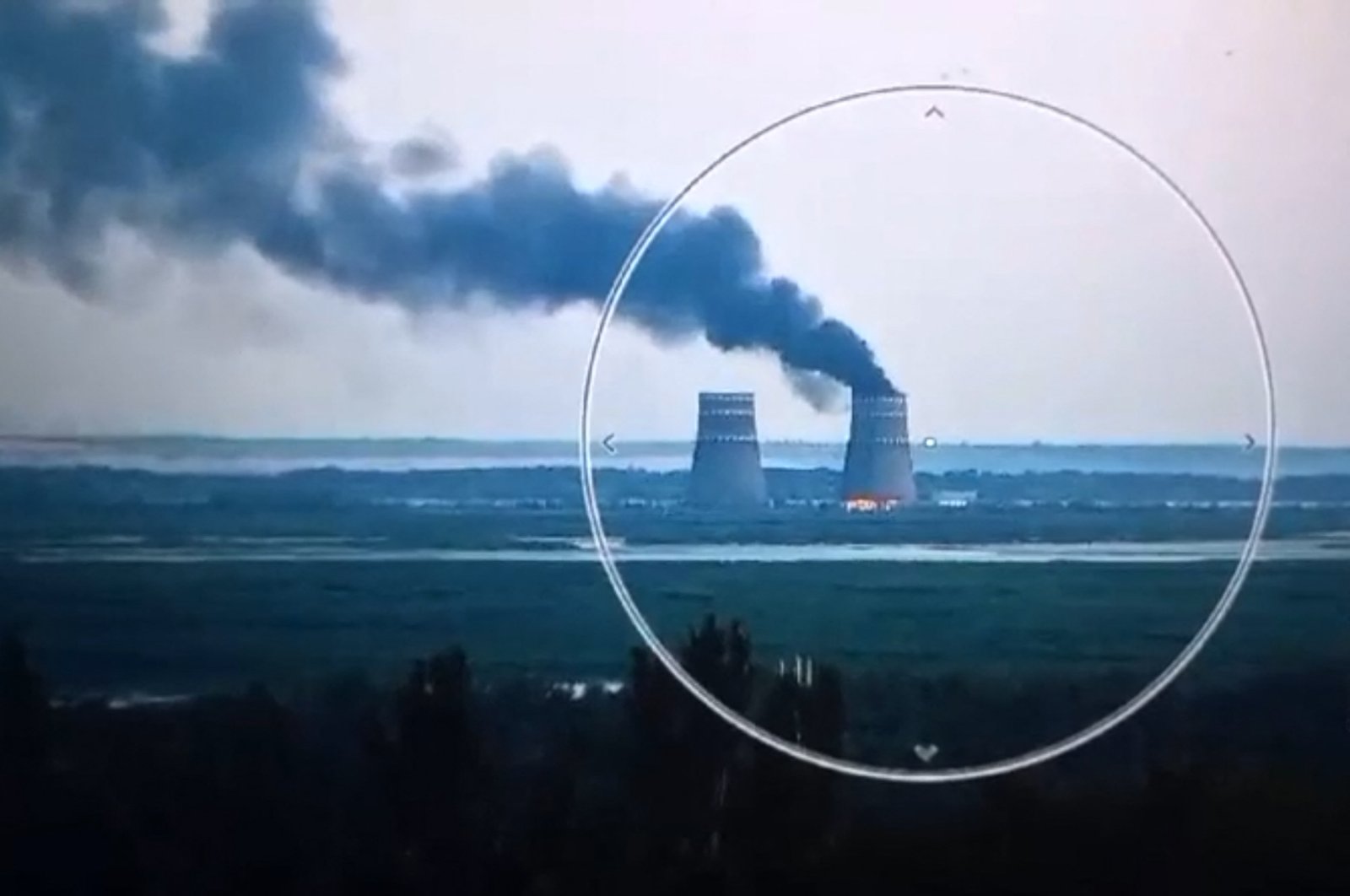 This video grab taken from handout footage released by the Ukrainian Presidential Press Service shows a fire at a cooling tower of the Russian-controlled  Zaporizhzhia Nuclear Power Plant plant, Energodar, Ukraine, Aug. 11, 2024.  (AFP Photo)