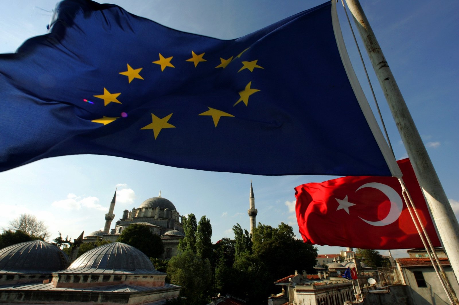 The flags of Türkiye and the European Union are seen from the roof of the historical shopping center Grand Bazaar, Istanbul, Türkiye, Oct. 5, 2005. (Reuters Photo)