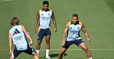 From left, Real Madrid's Luka Modric, Rodrygo and Kylian Mbappe attend a training session with teammates at the training ground of Valdebebas on the eve of their Liga football match against RCD Mallorca, Madrid, Spain, Aug. 17, 2024. (AFP Photo)