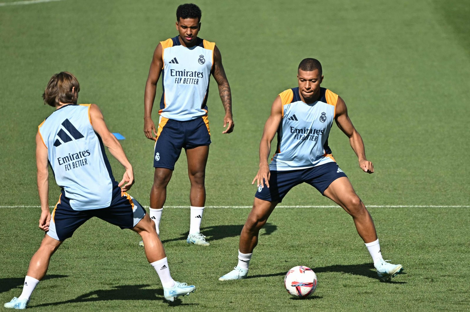 From left, Real Madrid&#039;s Luka Modric, Rodrygo and Kylian Mbappe attend a training session with teammates at the training ground of Valdebebas on the eve of their Liga football match against RCD Mallorca, Madrid, Spain, Aug. 17, 2024. (AFP Photo)