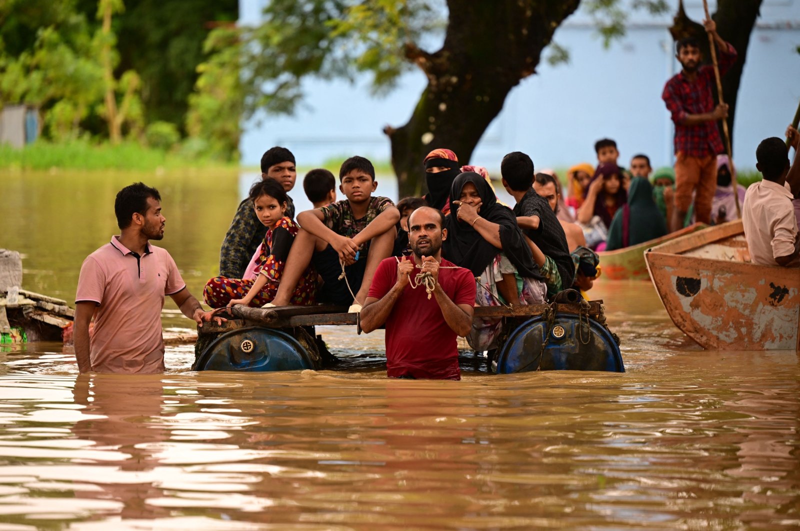 People wade through flood waters, Feni, Bangladesh, Aug. 23, 2024. (AFP Photo)