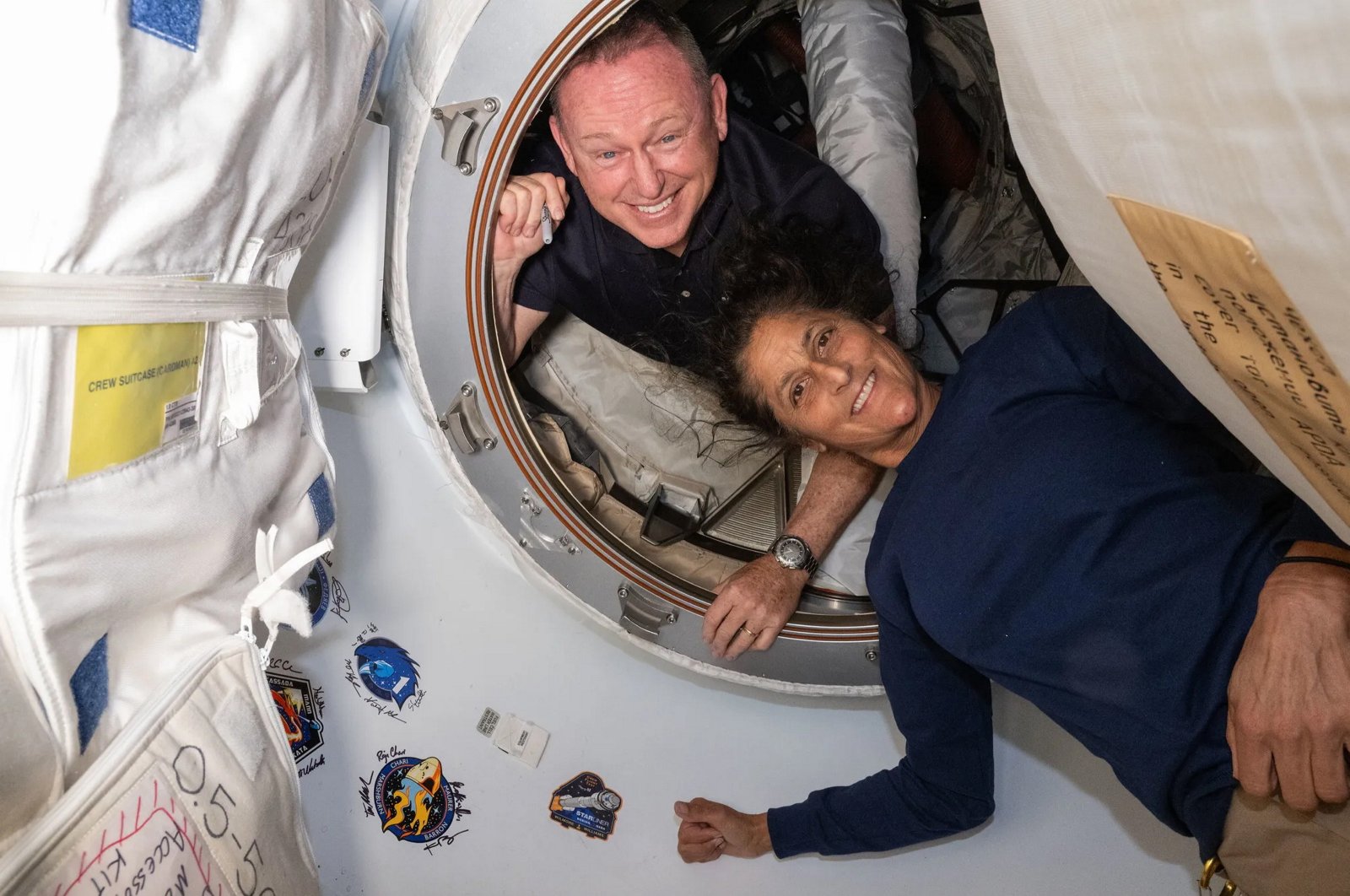 A handout photo made available by NASA on Aug. 24, 2024, shows NASA&#039;s Boeing crew test flight astronauts (from top) Butch Wilmore and Suni Williams posing for a portrait inside the vestibule between the forward port on the International Space Station&#039;s Harmony module and Boeing&#039;s Starliner spacecraft on June 13, 2024. (EPA Photo)