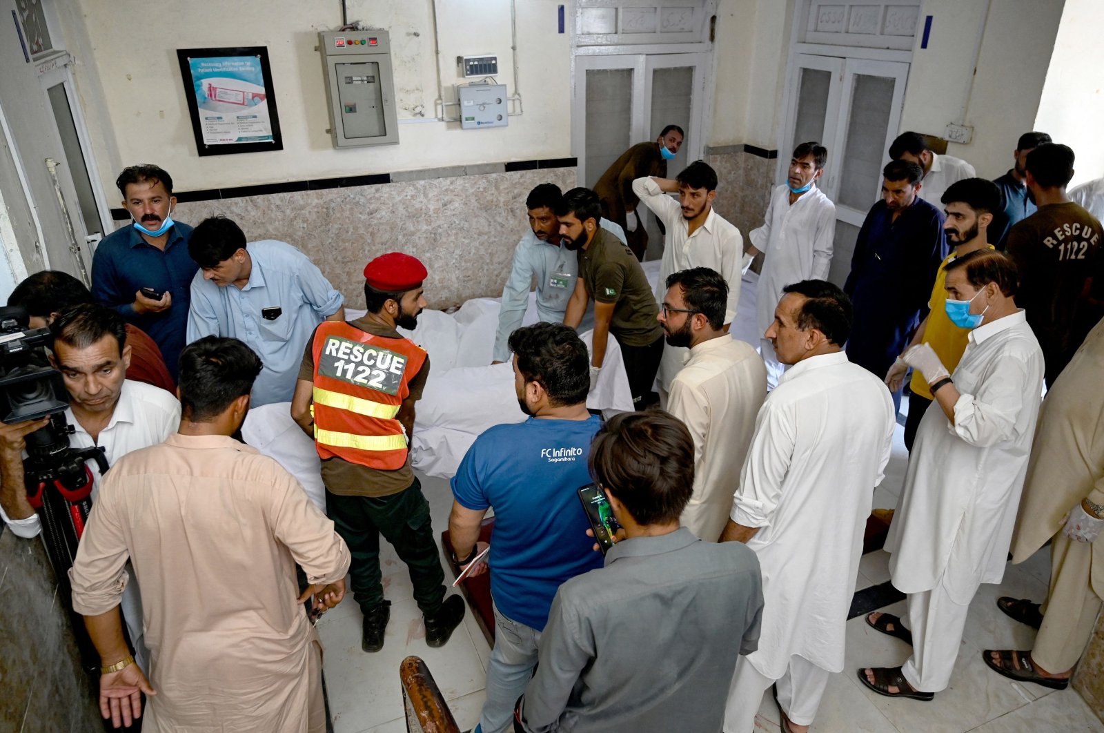 Paramedics and rescue workers carry the bodies of bus accident victims at a hospial in Kahuta, Punjab province, Pakistan, Aug. 25, 2024. (AFP Photo)