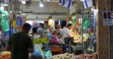 People shop in a market, amid rising tensions between Israel and Hezbollah, in Haifa, northern Israel, Aug. 5, 2024. (Reuters Photo)