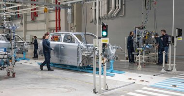 Employees work on a car assembly line at a factory of Togg at the Gemlik Togg Technology Campus in Bursa, northwestern Türkiye, May 17, 2024. (AFP Photo)