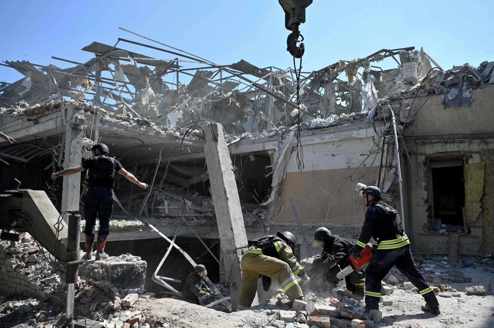 Ukrainian emergency services carry out a search and rescue operation among the rubble of a destroyed hotel after a strike in Kramatorsk, Ukraine, Aug. 25, 2024. (AFP Photo)