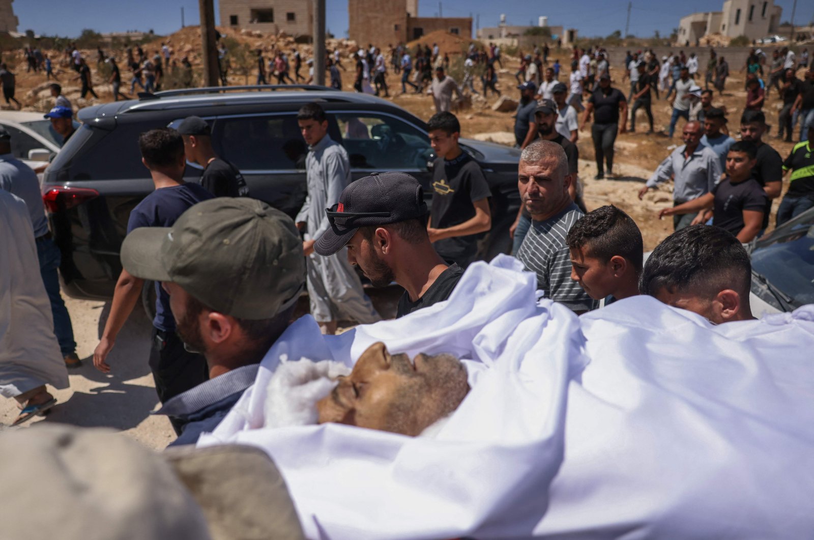 Palestinians carry the shrouded body of Iyad al-Najjar during his funeral in Yatta village south of Hebron city in the occupied West Bank after he was killed earlier by Israeli security forces near the village, Aug. 26, 2024. (AFP Photo)