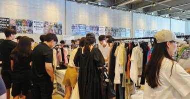People shop at a flea market hosted by Bunjang, an e-commerce platform for secondhand sales, Seoul, South Korea, Aug. 3, 2024. (Reuters Photo)