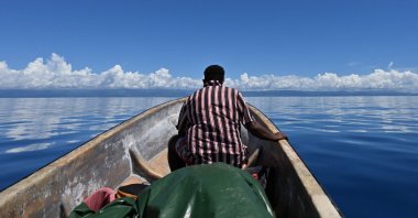 A fisherman sailing back to the shore in Honiara, the capital city of the Solomon Islands, April 20, 2024. (AFP Photo)