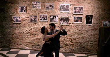 Professional &quot;Tango Taxi dancers&quot; David Tolosa and Laura Florencia Guardia pose for a picture during a milonga at the Marabu tango saloon in Buenos Aires, Argentina, Aug. 17, 2024. (AFP Photo)