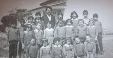 The photo shared by former Greek Cypriot Foreign Minister Erato Kozakau-Marcoullis shows children massacred by Greek Cypriots in 1974 in Muratağa, Cyprus. Şafak Nihat (2nd right, third row) was the only survivor among the slain children in the photo. (AA Photo)