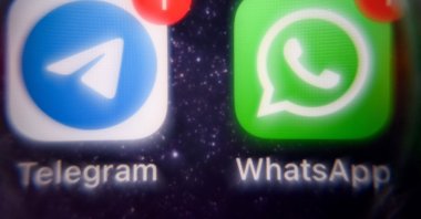 This picture shows the mobile messaging and call service Telegram logo and U.S. instant messaging software Whatsapp logo on a smartphone screen, Moscow, Russia, March 23, 2022. (AFP Photo)