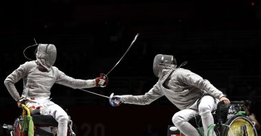 Hao Li (L) of Team China competes against Artem Manko of Team Ukraine during the Men&#039;s Sabre Individual Category A Final on Day 1 of the Tokyo 2020 Paralympic Games at Makuhari Messe Event Hall, Tokyo, Japan, Aug. 25, 2021. (Getty Images Photo)