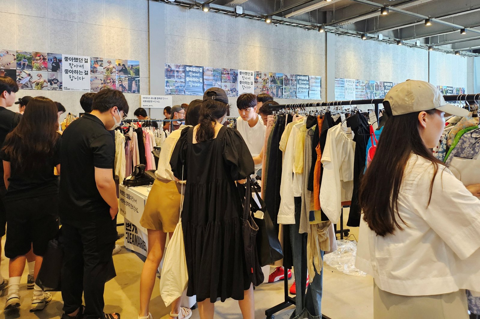 People shop at a flea market hosted by Bunjang, an e-commerce platform for secondhand sales, Seoul, South Korea, Aug. 3, 2024. (Reuters Photo)