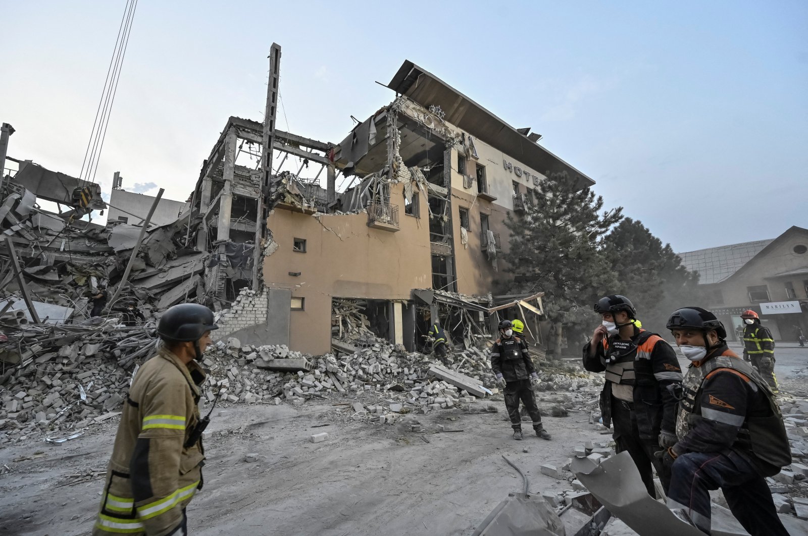 Rescuers stand at a site of a Russian missile strike in Kryvyi Rih, Ukraine, Aug. 27, 2024. (Reuters Photo)