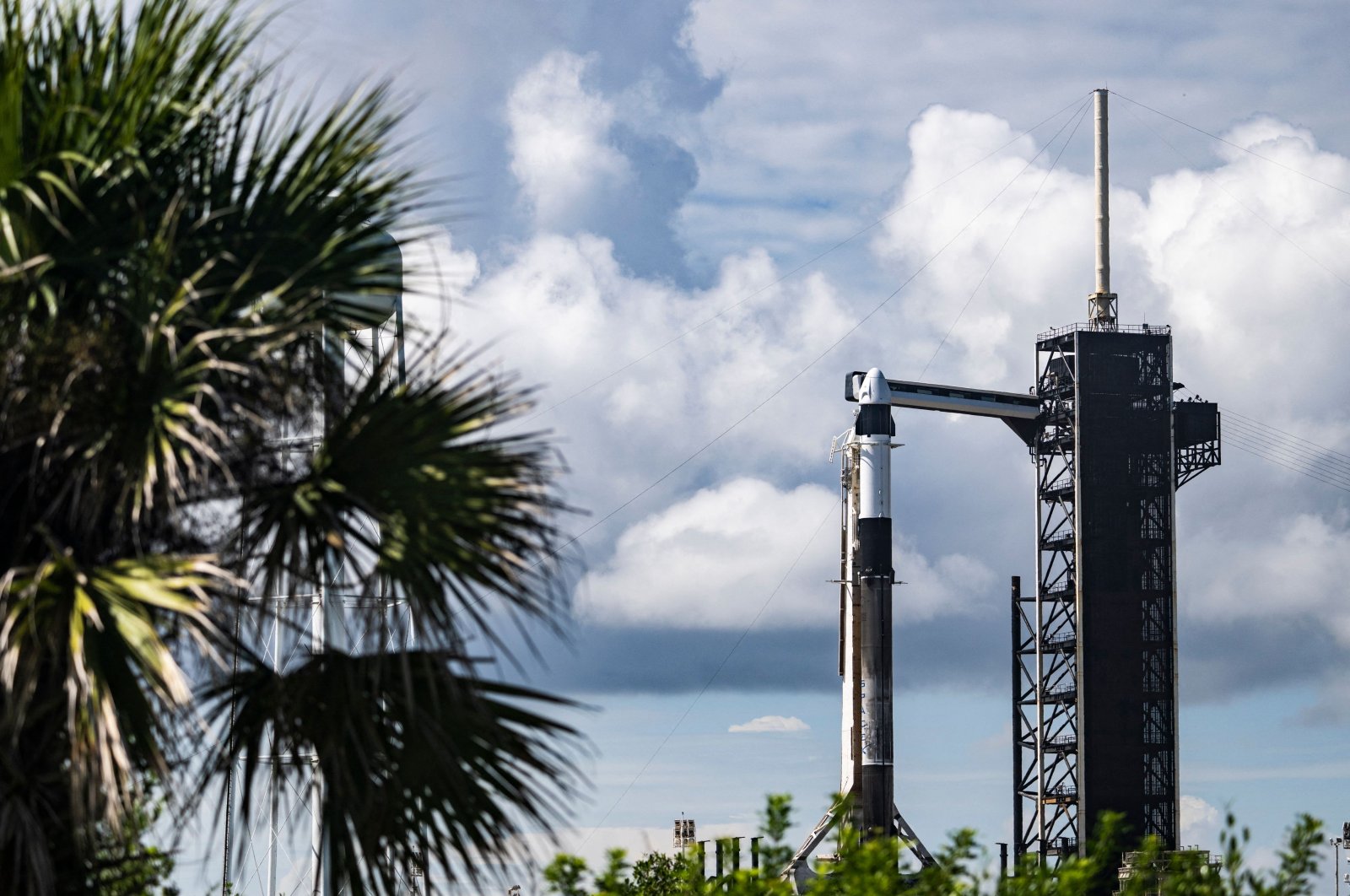 A SpaceX Falcon 9 rocket with the Crew Dragon Resilience capsule sits on Launch Complex 39A at Kennedy Space Center ahead of the Polaris Dawn Mission due to launch on Aug. 27 at the Kennedy Space Center in Florida, U.S., Aug. 26, 2024. (AFP Photo)