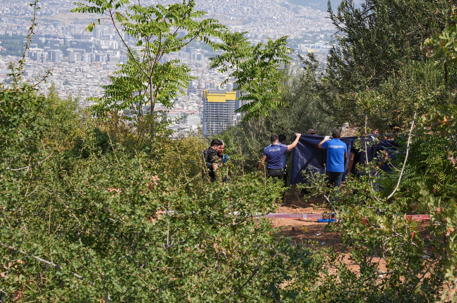 Authorities conducted an investigation at the crime scene in Bornova, Izmir, western Türkiye, Aug. 27, 2024. (AA Photo)