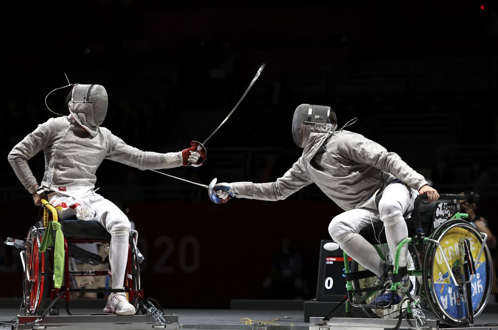 Hao Li (L) of Team China competes against Artem Manko of Team Ukraine during the Men&#039;s Sabre Individual Category A Final on Day 1 of the Tokyo 2020 Paralympic Games at Makuhari Messe Event Hall, Tokyo, Japan, Aug. 25, 2021. (Getty Images Photo)