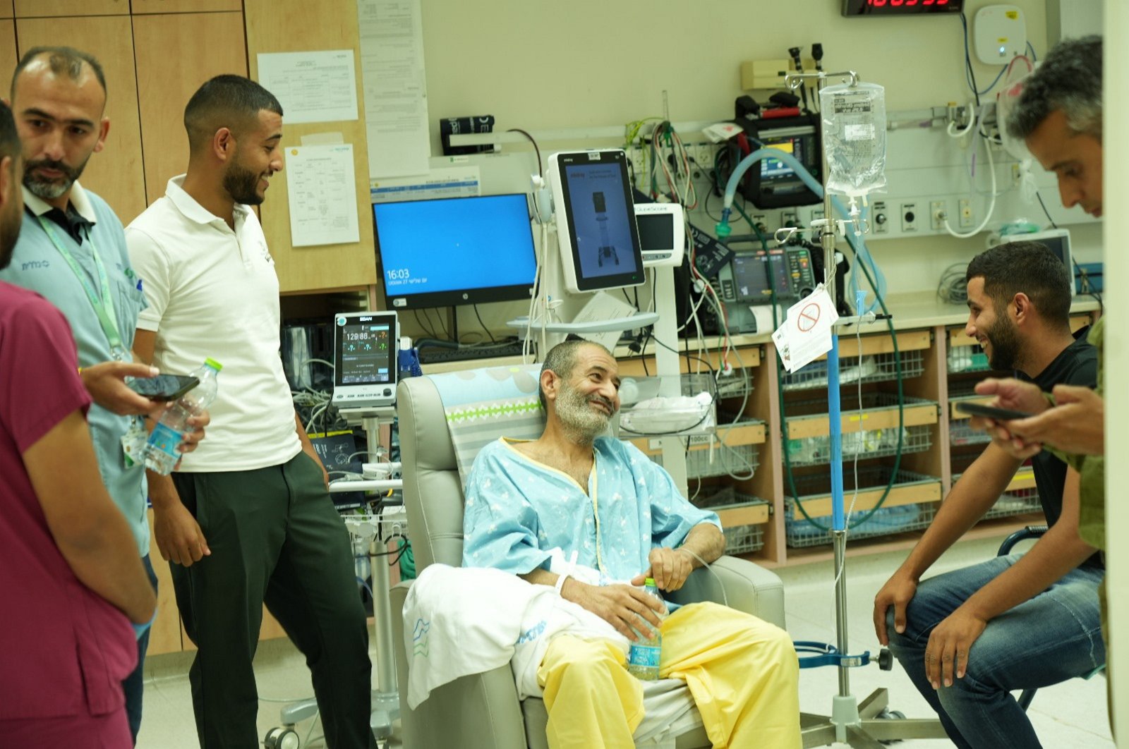 A handout photo made available by Israel&#039;s Government Press Office (GPO) shows a meeting between Farhan Qadi (C), who was rescued from being held hostage by Hamas in Gaza, and members of his family at Soroka Medical Center in Be&#039;er Sheva, Israel,  Aug. 27, 2024. (EPA Photo)