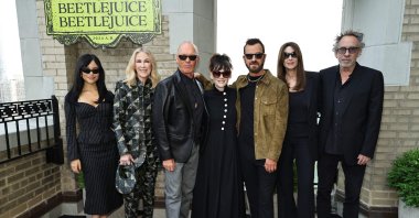 (L-R) Jenna Ortega, Catherine O&#039;Hara, Michael Keaton, Winona Ryder, Justin Theroux, Monica Bellucci and Tim Burton attend the &quot;Beetlejuice Beetlejuice&quot; New York photo call at JW Marriott Essex House, New York City, New York, U.S., Aug. 17, 2024. (AFP Photo)