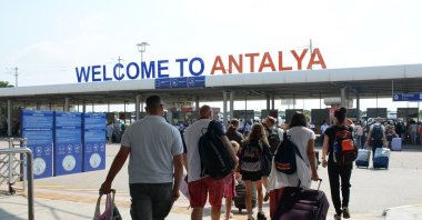 Tourists are photographed at Antalya Airport, Antalya, southern Türkiye, July 31, 2024. (IHA Photo)