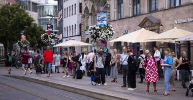Electoral posters of the far-right Alternative for Germany party (AfD) using the slogan "Summer, Sun, Remigration" and depicting a plane dubbed "Deportation Airline" are displayed at a public transport station in the capital of German federal state Thuringia, in Erfurt, Germany, Aug. 14, 2024. (AP Photo)