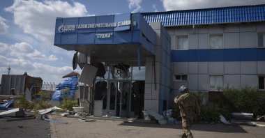 A Ukrainian soldier approaches a gas metering station of Russian energy giant Gazprom in Sudzha, Kursk region, Russia, Aug. 16, 2024. (AP Photo)
