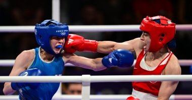 Türkiye's Buse Naz Çakıroğlu (R) punches Finland's Pihla Kaivo-Oja during the women's quarterfinals of the 50 kg. category at the Paris 2024 Olympic Games held at the North Paris Arena, Villepinte, France, Aug. 3, 2024. (AA Photo)