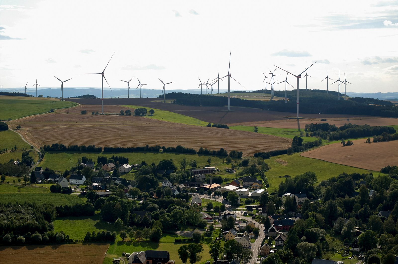 A view shows a wind farm behind Voigtsdorf near Dorfchemnitz, Germany, Aug. 9, 2024. (Reuters Photo)