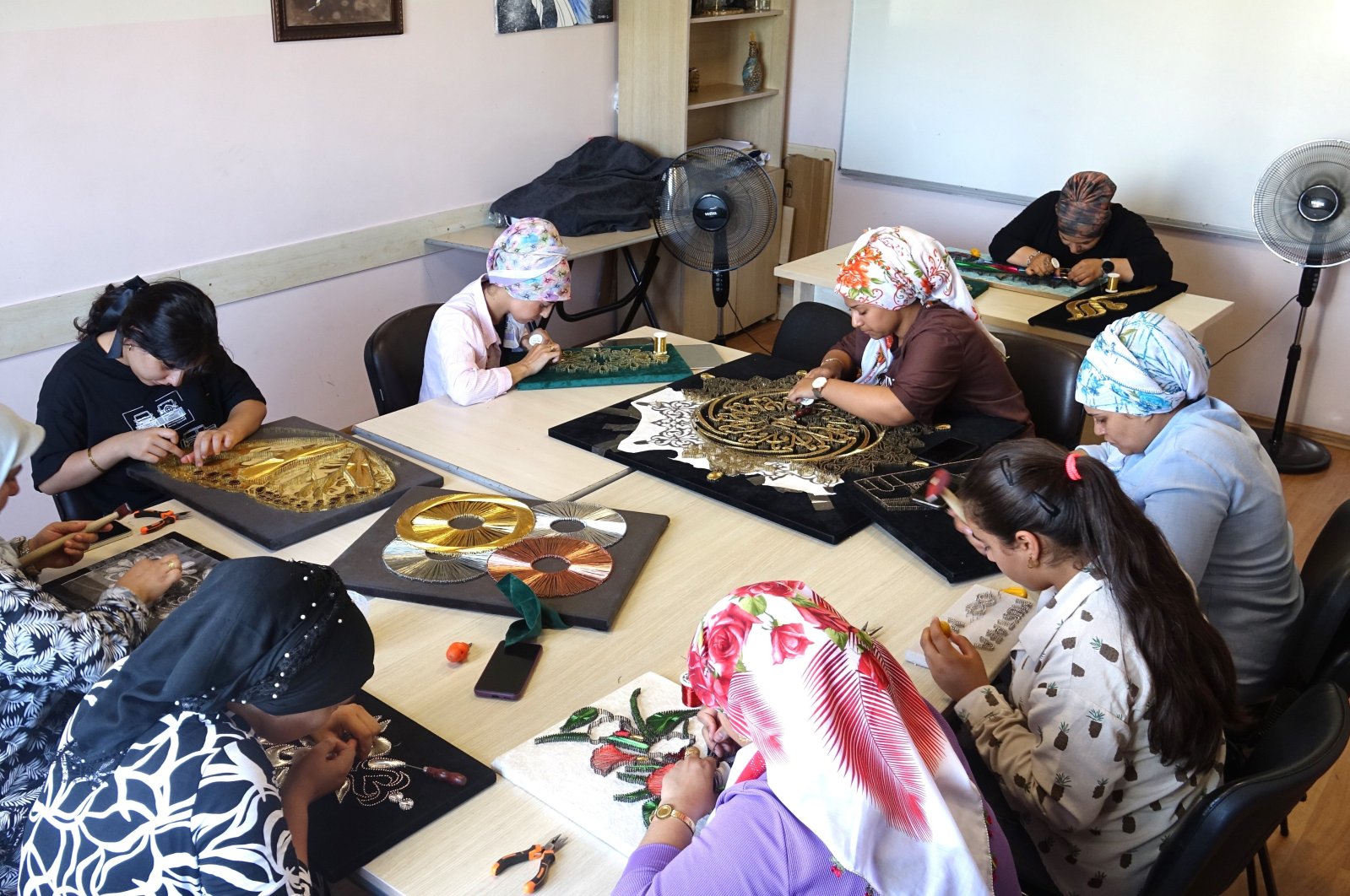 Women attending a filigree course work on creating art pieces, Gaziantep, Türkiye, Aug. 28, 2024. (IHA Photo)