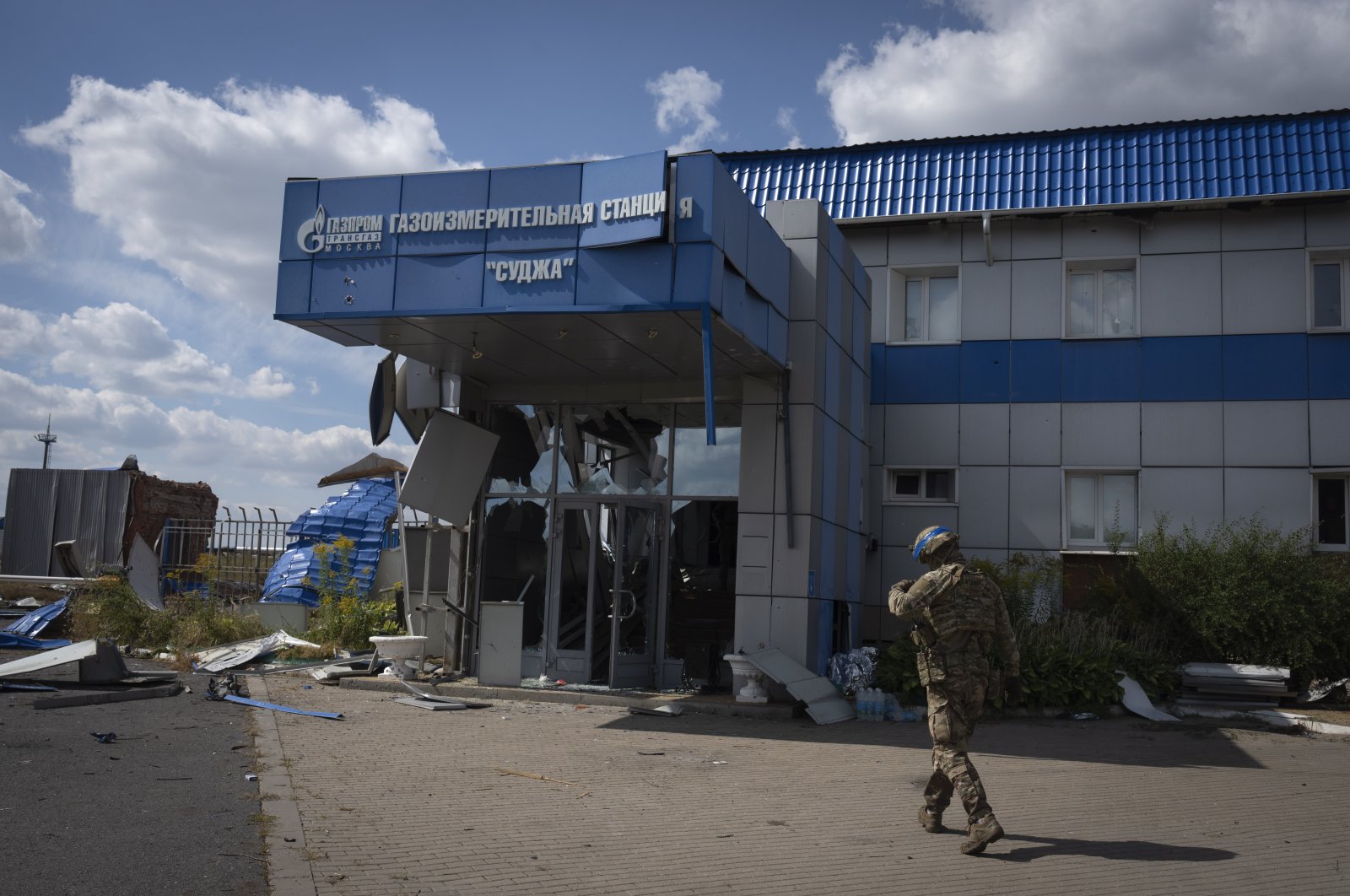 A Ukrainian soldier approaches a gas metering station of Russian energy giant Gazprom in Sudzha, Kursk region, Russia, Aug. 16, 2024. (AP Photo)