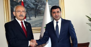 Kemal Kılıçdaroğlu (L) and Selahattin Demirtaş, then-chairs of the Republican People's Party (CHP) and the now-defunct Peoples’ Democratic Party (HDP), respectively, shake hands during a "Gezi Solidarity" event, Istanbul, Türkiye, March 14, 2016. (Sabah File Photo)