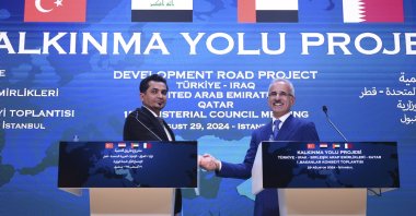Transportation Minister Abdulkadir Uraloğlu and his Iraqi counterpart Razzaq Muhaibas Al-Saadawi shake hands at the summit in Istanbul, Aug. 29, 2024. (AA Photo)