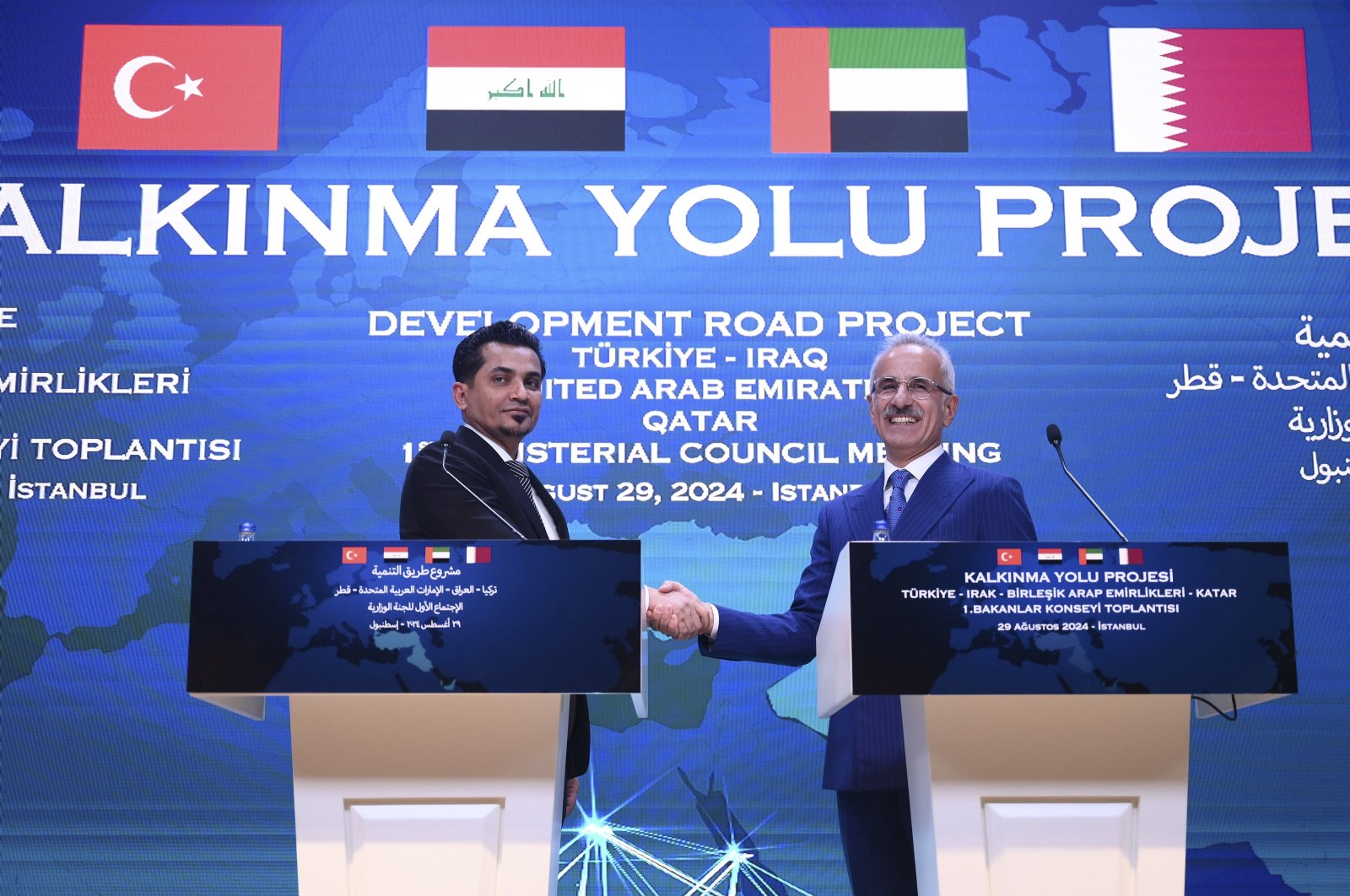 Transportation Minister Abdulkadir Uraloğlu and his Iraqi counterpart Razzaq Muhaibas Al-Saadawi shake hands at the summit in Istanbul, Aug. 29, 2024. (AA Photo)