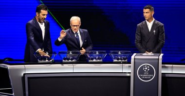 (L-R) Italy’s former goalkeeper Gianluigi Buffon, UEFA Deputy Secretary-General Giorgio Marchetti and Al-Nassr’s forward Cristiano Ronaldo during the ceremony of the draw for the group stage of the UEFA Champions League, Monaco, Aug. 29, 2024.