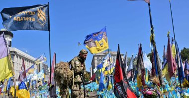 A wounded Ukrainian serviceman visits a designated area for commemorating fallen Ukrainian soldiers at the Independence Square during the Remembrance Day of Defenders of Ukraine, Kyiv, Ukraine, Aug. 29, 2024. (AFP Photo)
