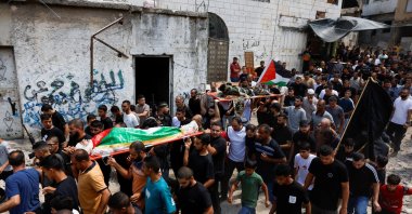 Mourners carry the body of a Palestinian who was killed by Israeli forces, during his funeral in Nur Shams refugee camp, near Tulkarm in the Israeli-occupied West Bank, Palestine, Aug. 30, 2024. (Reuters Photo)