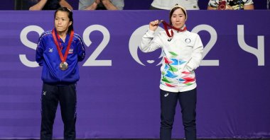 Zakia Khudadadi of the Refugee Paralympic Team (R) celebrates on the podium during the medal ceremony at the Paris 2024 Paralympics, Grand Palais, Paris, France, Aug. 29, 2024. (Reuters Photo)