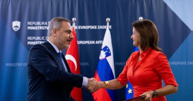 Foreign Minister Hakan Fidan and Slovenian counterpart Tanja Fajon shake hands after a meeting in Ljubljana, Slovenia, Aug. 30, 2024. (AA Photo)