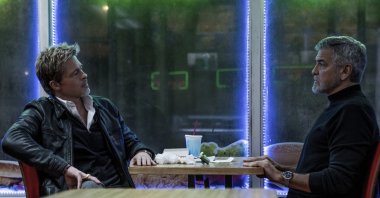 This image released by Apple TV  shows Brad Pitt (L) and George Clooney in a scene from &quot;Wolfs.&quot; (AP Photo)