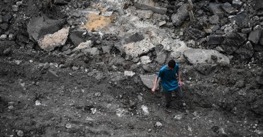 A Palestinian man walks on a street torn up by bulldozers during an Israeli raid in the occupied West Bank city of Jenin, Palestine, Sept. 1, 2024. (AFP Photo)