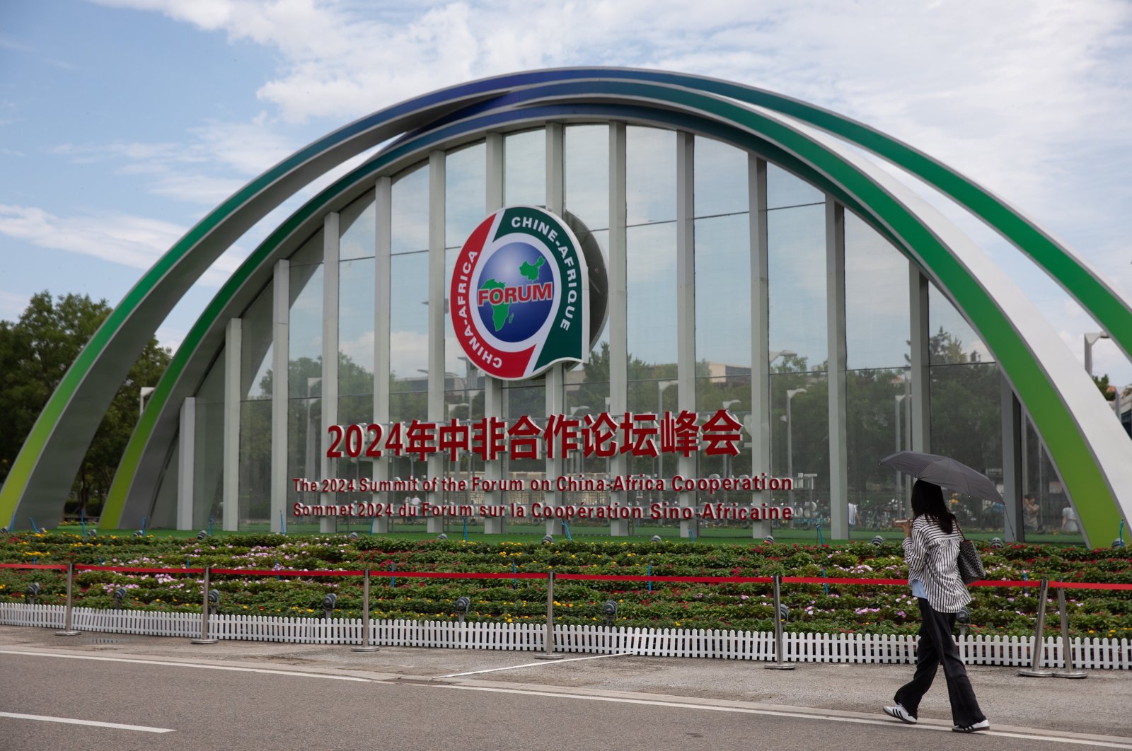 A person passes by signage for the Summit of the Forum on China-Africa Cooperation (FOCAC), Beijing, China, Sept. 1, 2024. (EPA Photo)