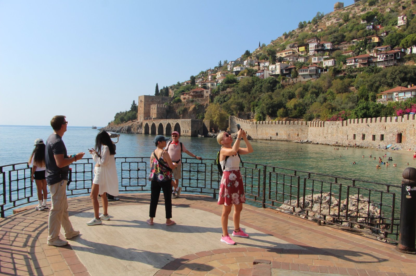 Tourists are photographed in the Alanya district of Antalya, southern Türkiye, Aug, 26, 2024. (AA Photo)